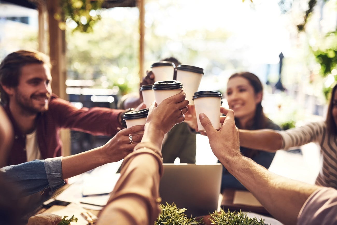 Colleagues toasting over coffee