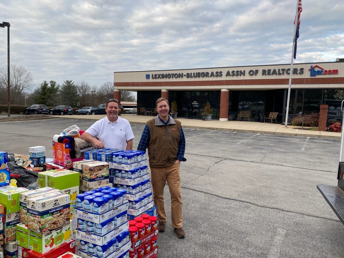 Greg Blatt and Carlton Jackson from Dayton REALTORS® delivering supplies to disaster victims