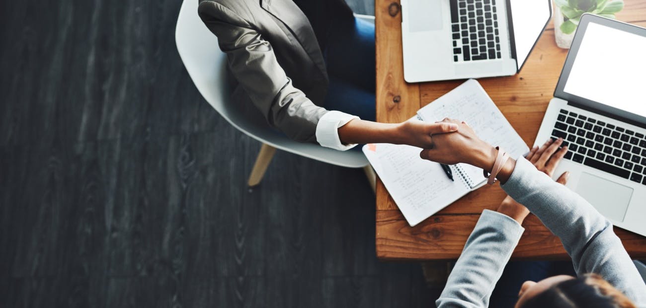 two business people collaborating in high angle shot