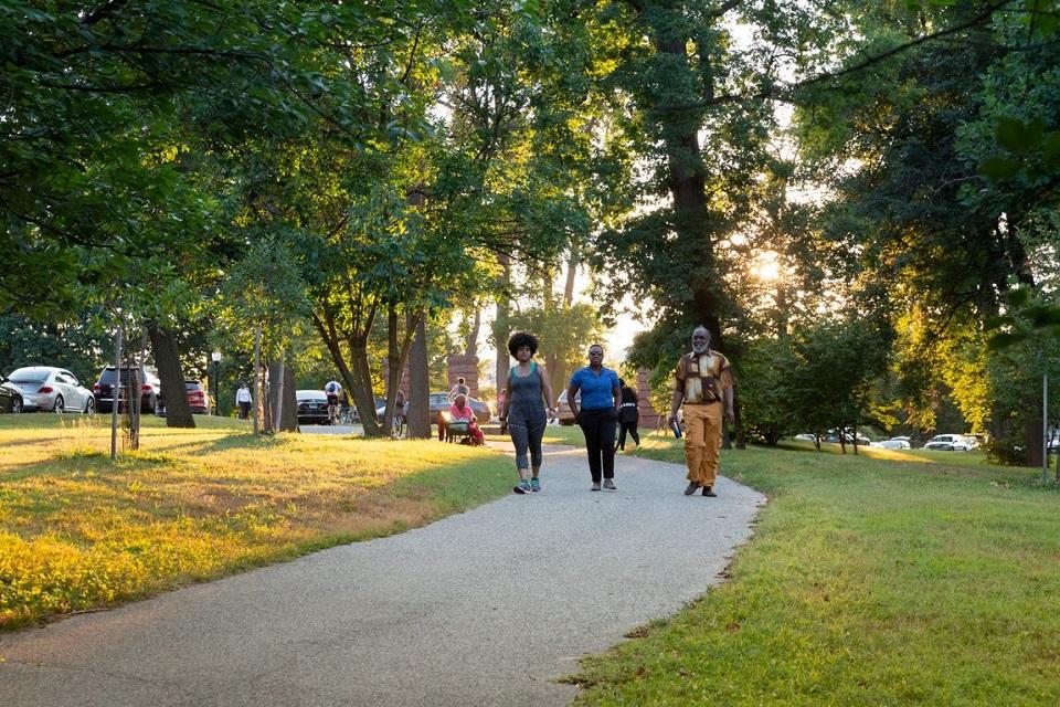 People walking on the Jones Falls Trail in Baltimore, MD