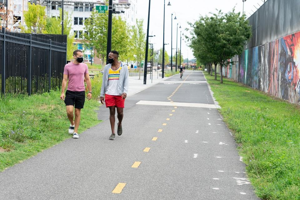 Two men walking on the Met Branch Trail in Washington, DC