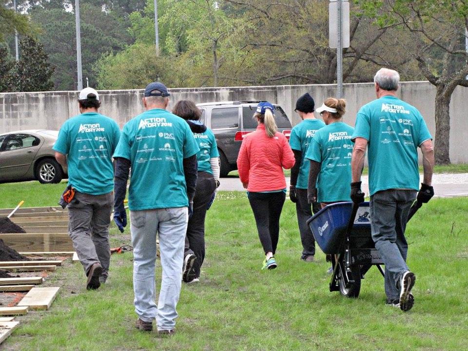 Wilmington Regional Association of REALTORS® staff working on a community garden in Wilmington, NC