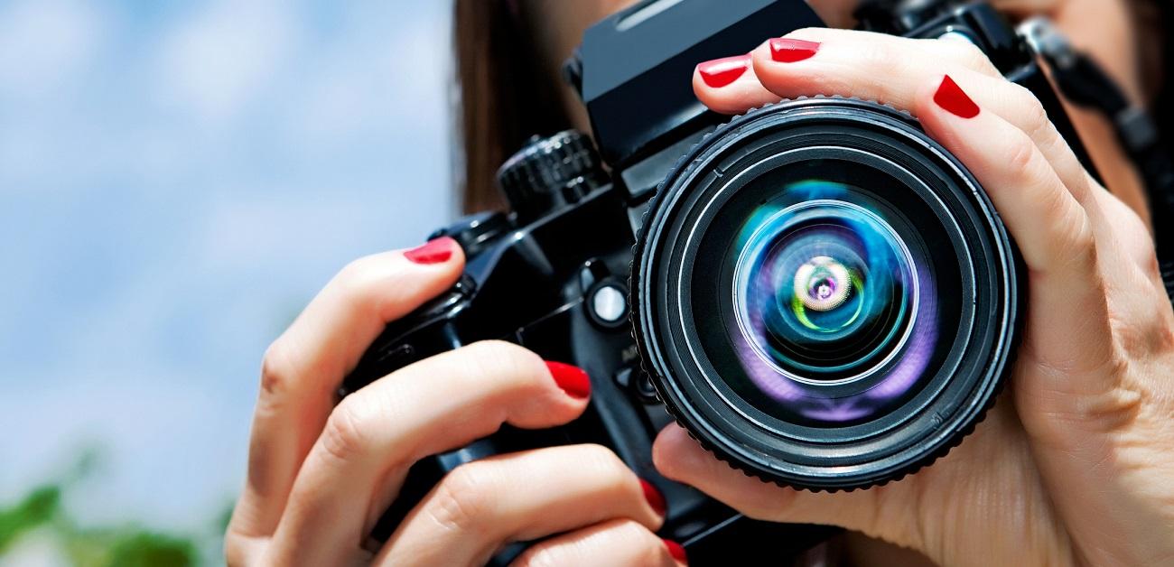 Woman taking a picture with camera