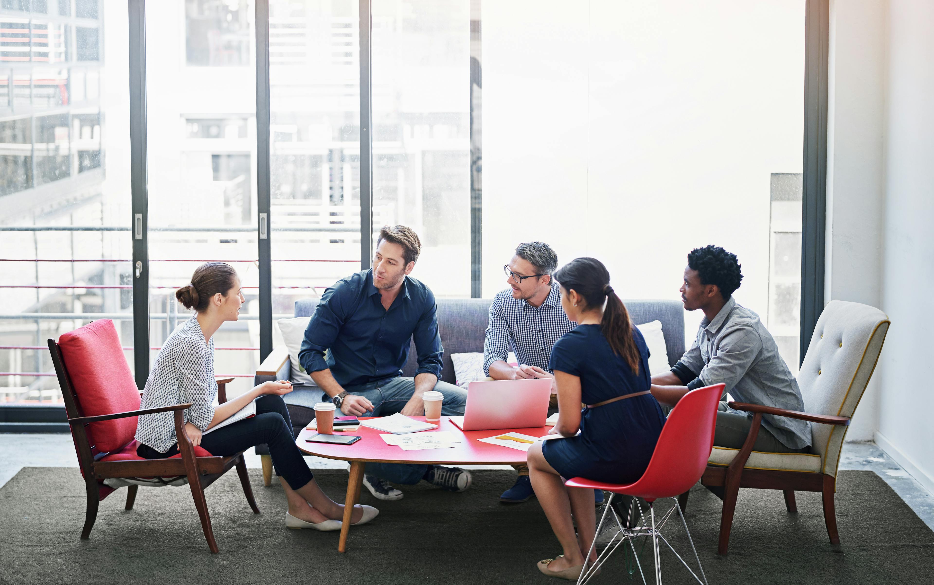 Group of young coworkers having a business meeting 