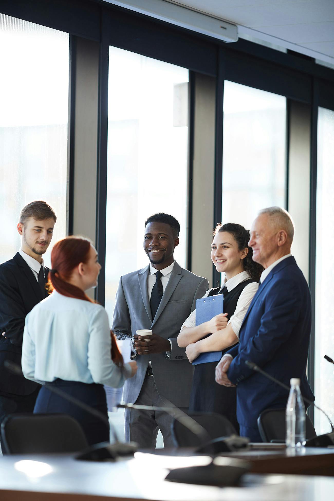 Group of professionals talking in an office