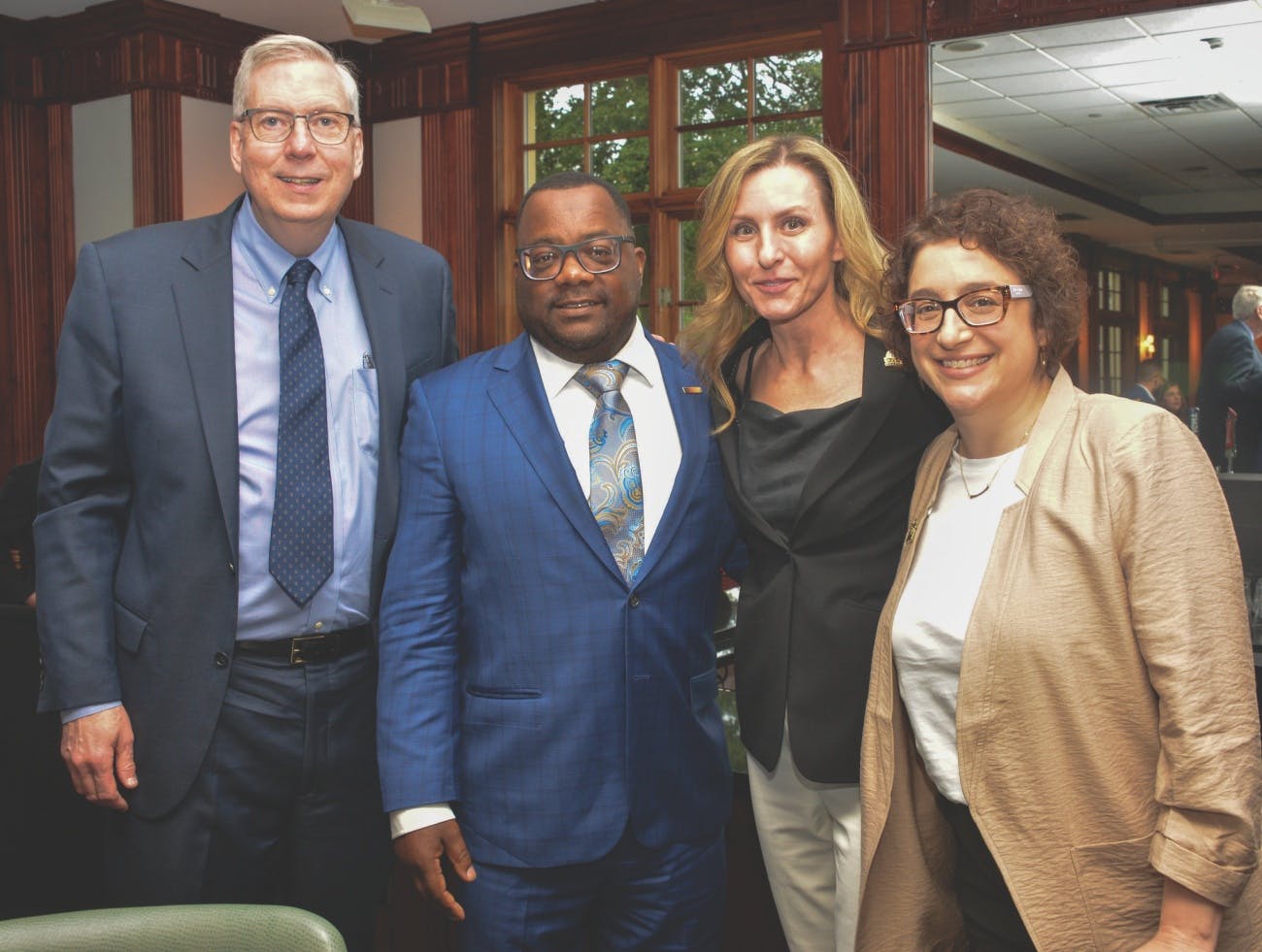 Tessa Hultz (second from right) poses with panelists Bill Dedman, Bryan Greene and Alexia Smokler