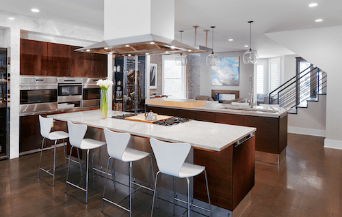 Modern Kitchen With Large Island and Dark Cabinets