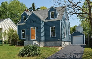 White house after renovation painted in blue