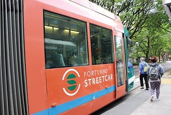 A red street car in Portland, OR