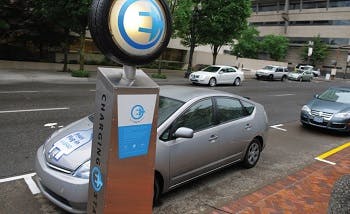 A car parked next to a charging station