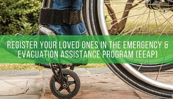 A wheelchair with a greeen banner over it asking people to register in emergency and evacuation assistance program