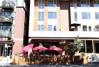 A mixed-use development in Portland showing a tavern on the ground floor with apartments above it