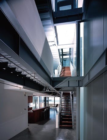 Multi-level home showing a kitchen and two flights of stairs