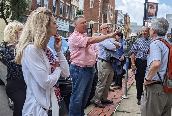 Counselors of Real Estate (CRE) in Greensburg, PA, touring various downtown sites