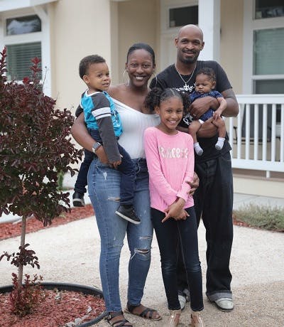 African American family in front of their house