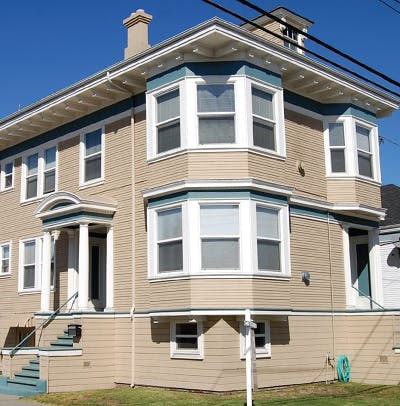 Beige two-story home in corner lot