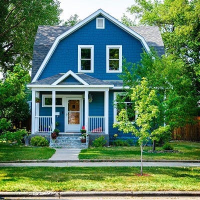 Blue house front yard and porch