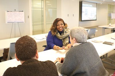 Dr. Tiffany Manuel sitting in a meeting