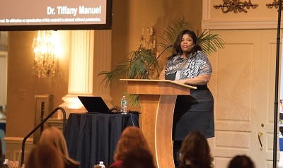 Dr. Tiffany Manuel speaking at an event