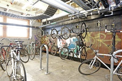 Bike storage area at Lampwork Lofts, a former lampwork factory in Oakland, CA, converted into housing.