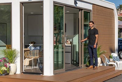 Man entering a manufactured home