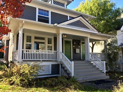 Front yard of a new Cape Cod style home. 