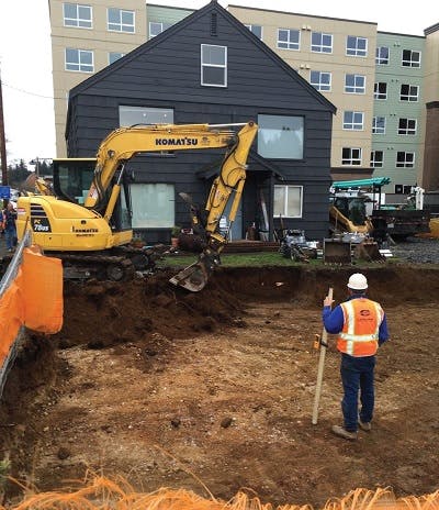 A construction area in Traverse City, MI, near 5-story apartment buildings