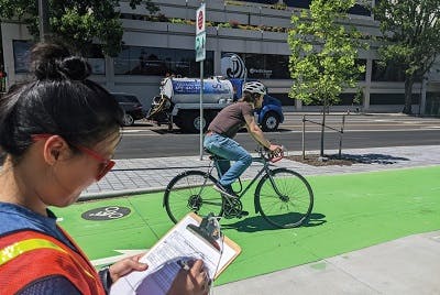 Man riding bicycle on bike lane