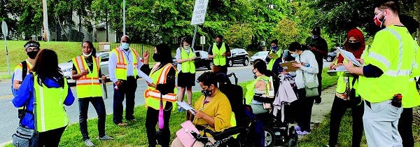 Montgomery County community engagement in a park with people answering surveys