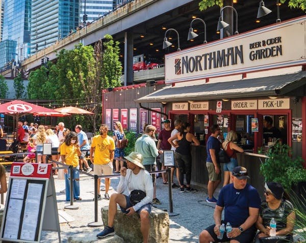 People standing in line at a beer garden in Chicago