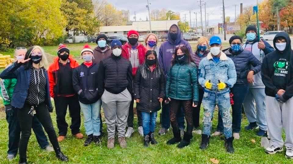 Group of people in a park wearing masks