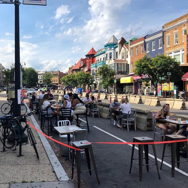 Restaurant's outdoor sitting area set up on the street in the Adams Morgan neighborhood, Washington, DC