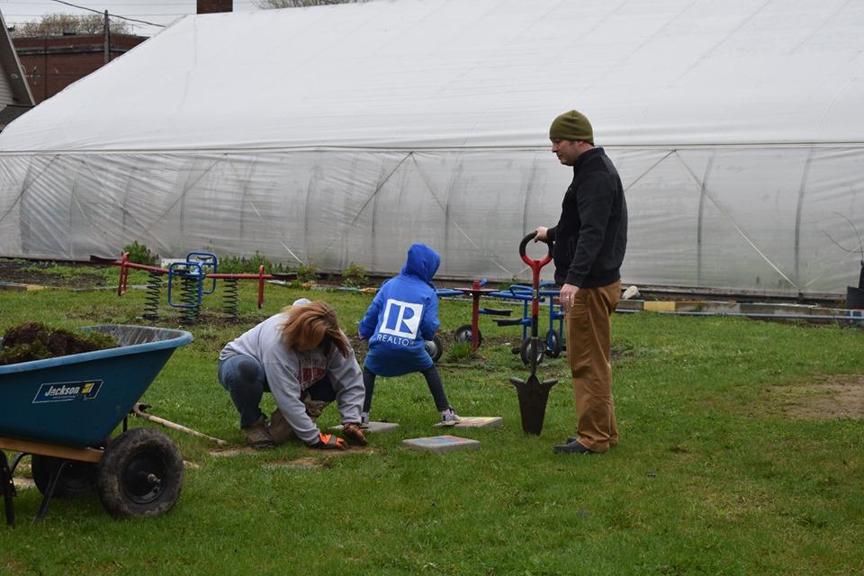 Lansing, MI, Pop-Up Park - realtors planting a tree in the park