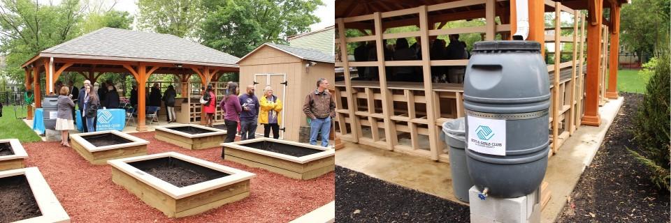 Large rectangular plant beds in front of a pavillion with people talking, a tank to recycle rain water coming from the gutters.