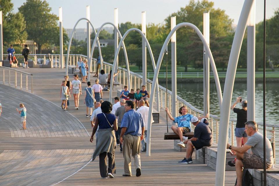 People walking on the boardwalk at The Wharf