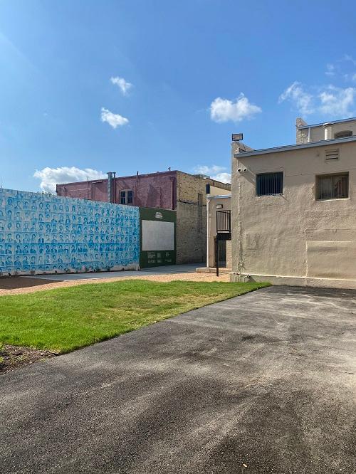 Before: The empty alley and lot that became La Zona. Looking east from North Laredo Street.