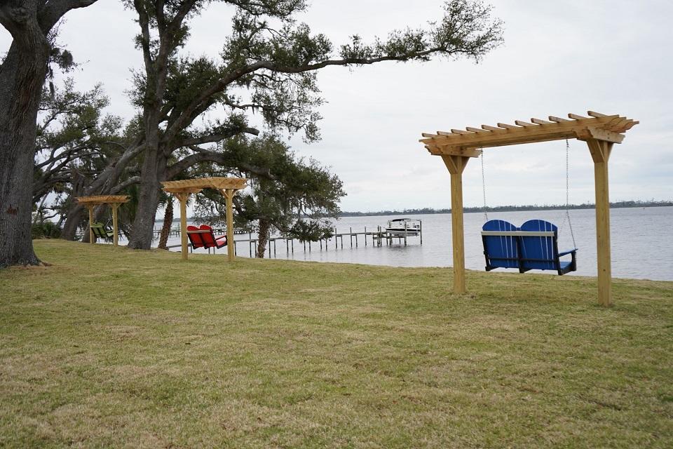 Pergola swing benches overlooking the bay at Adams Park, Panama City, FL