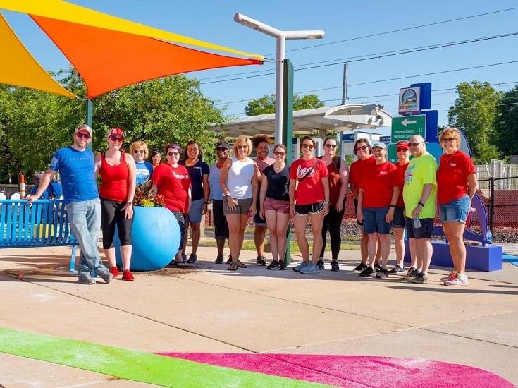 Volunteers pose proudly with their handiwork at the Belleville Transit Center in Belleville, IL. 