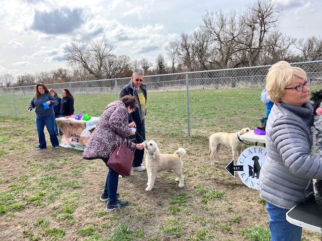 A thirsty pup gets a refreshing drink at the grand opening.