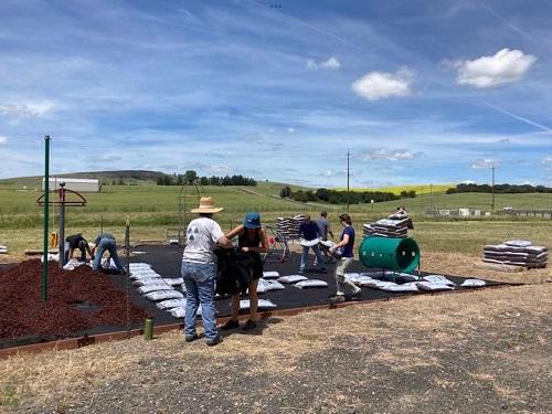 Volunteers building playground at the Viola Community Center