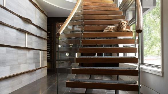 dramatic curved staircase in foyer