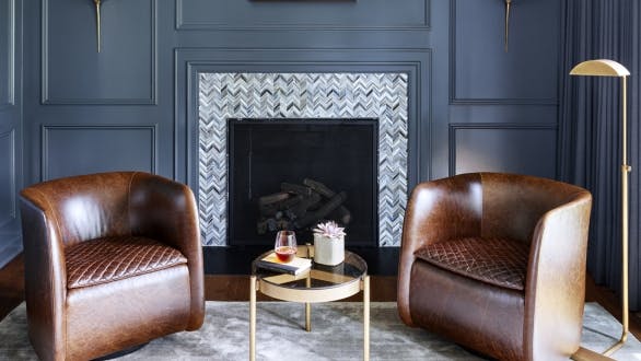 sitting area, dark blue walls, light area rug