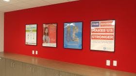 Image of framed program and product posters from NAR. 