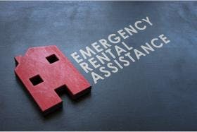 Emergency Rental Assistance Program ERAP. Red wooden home on the blackboard.