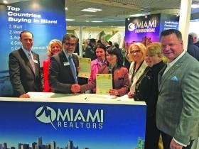 Miami REALTORS® at their booth at MIPIM 2019