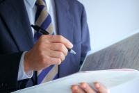 Man in Suit With Pen