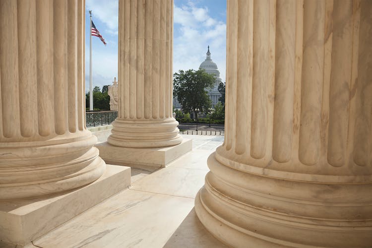 View of U.S. Capitol between columns