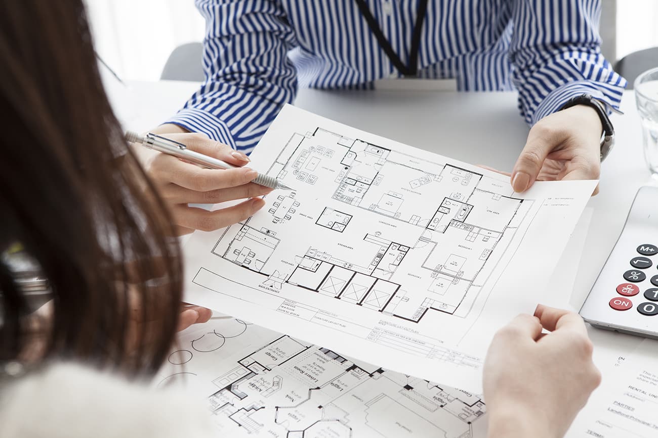 People looking at floor plans