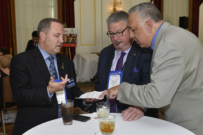 Geoffrey Kasselman strategizes with fellow SIOR members
