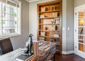 Home office with built in bookcase and natural light